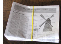 A bundle of today's papers.